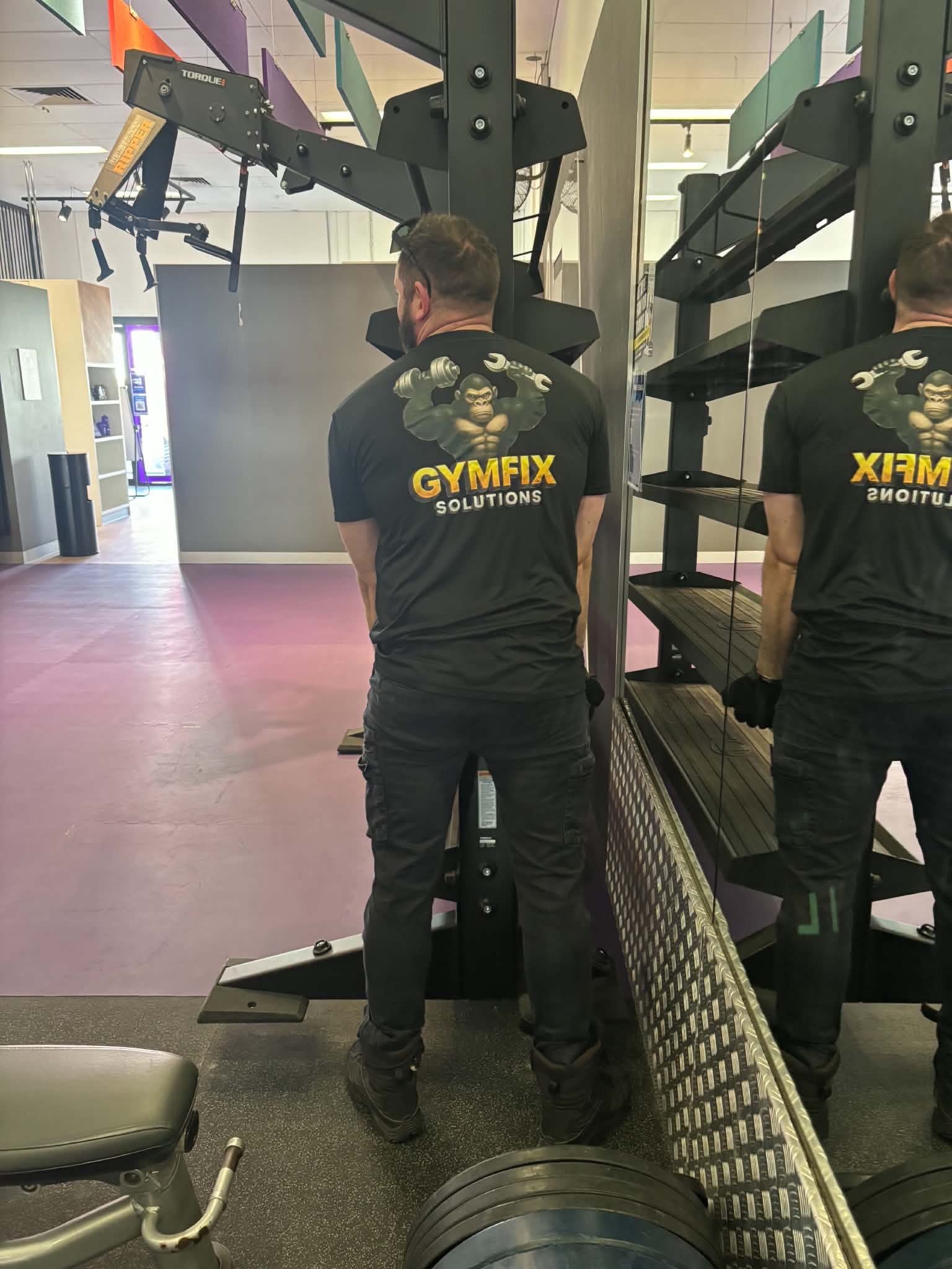 GymFix technician servicing commercial gym equipment